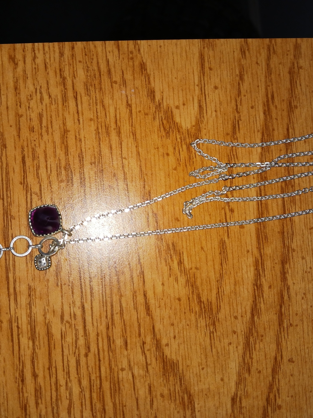 Silver Necklace with Purple Square Gem and Charm Accents